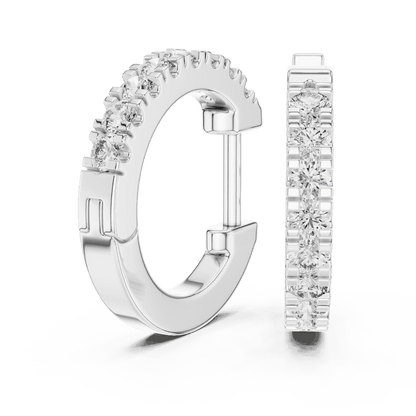Diamond huggie hoop earrings featuring a row of sparkling round stones with a secure hinged closure by Orova Jewels.