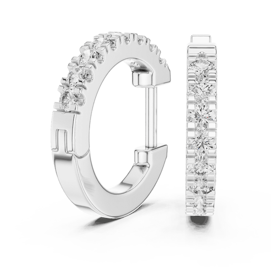 Diamond huggie hoop earrings featuring a row of sparkling round stones with a secure hinged closure by Orova Jewels.