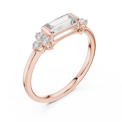 Emerald Cut Diamond Three-Stone Engagement Ring featuring an emerald-cut center stone with round diamond side accents on a polished band by Orova Jewels.